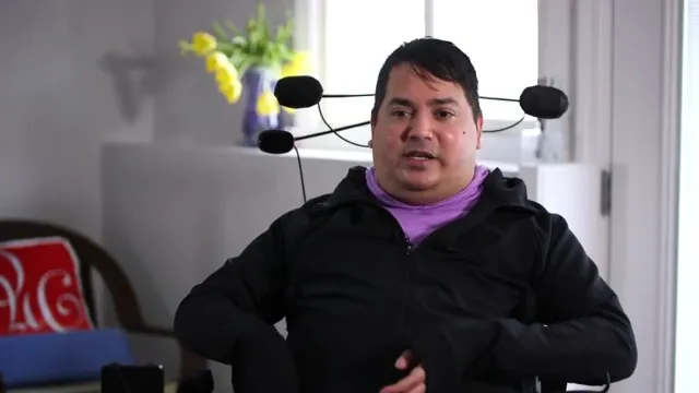 Paralyzed man able to pet dog for first time in years after brain implant