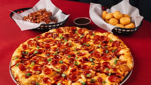 Pizza chain puts Dr Pepper on pizza and wings for wild new menu