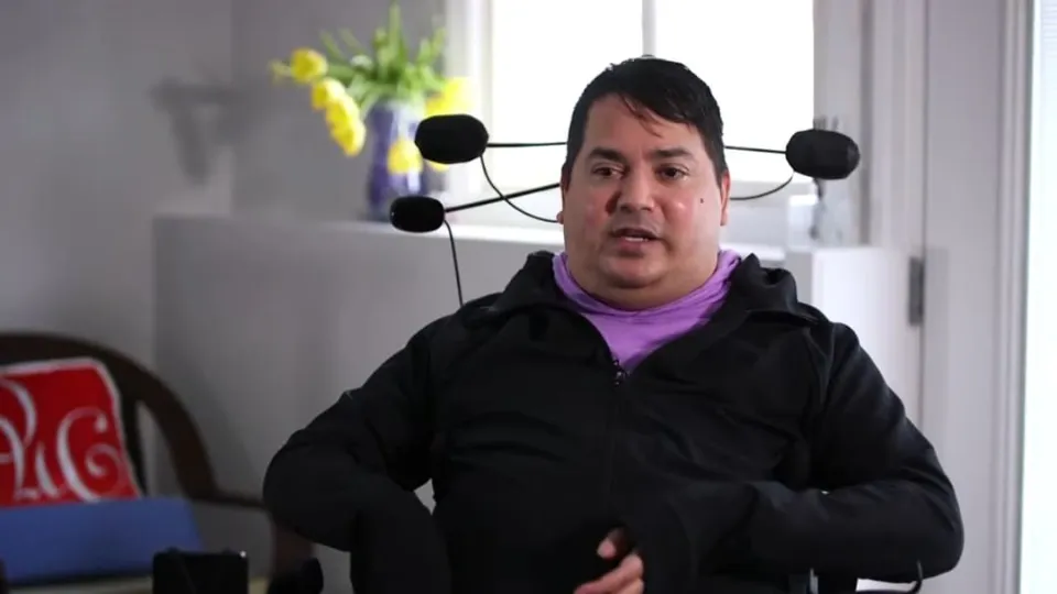 Paralyzed man able to pet dog for first time in years after brain implant