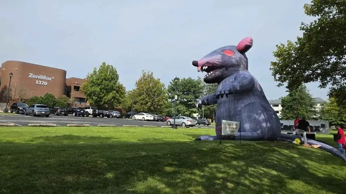 As Xbox head Asha Sharma reportedly visits Bethesda HQ, workers put up red flags representing laid off staff and a giant inflatable rat outside